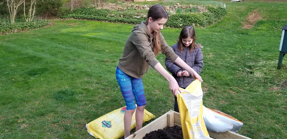 Young ladies preparing our garden